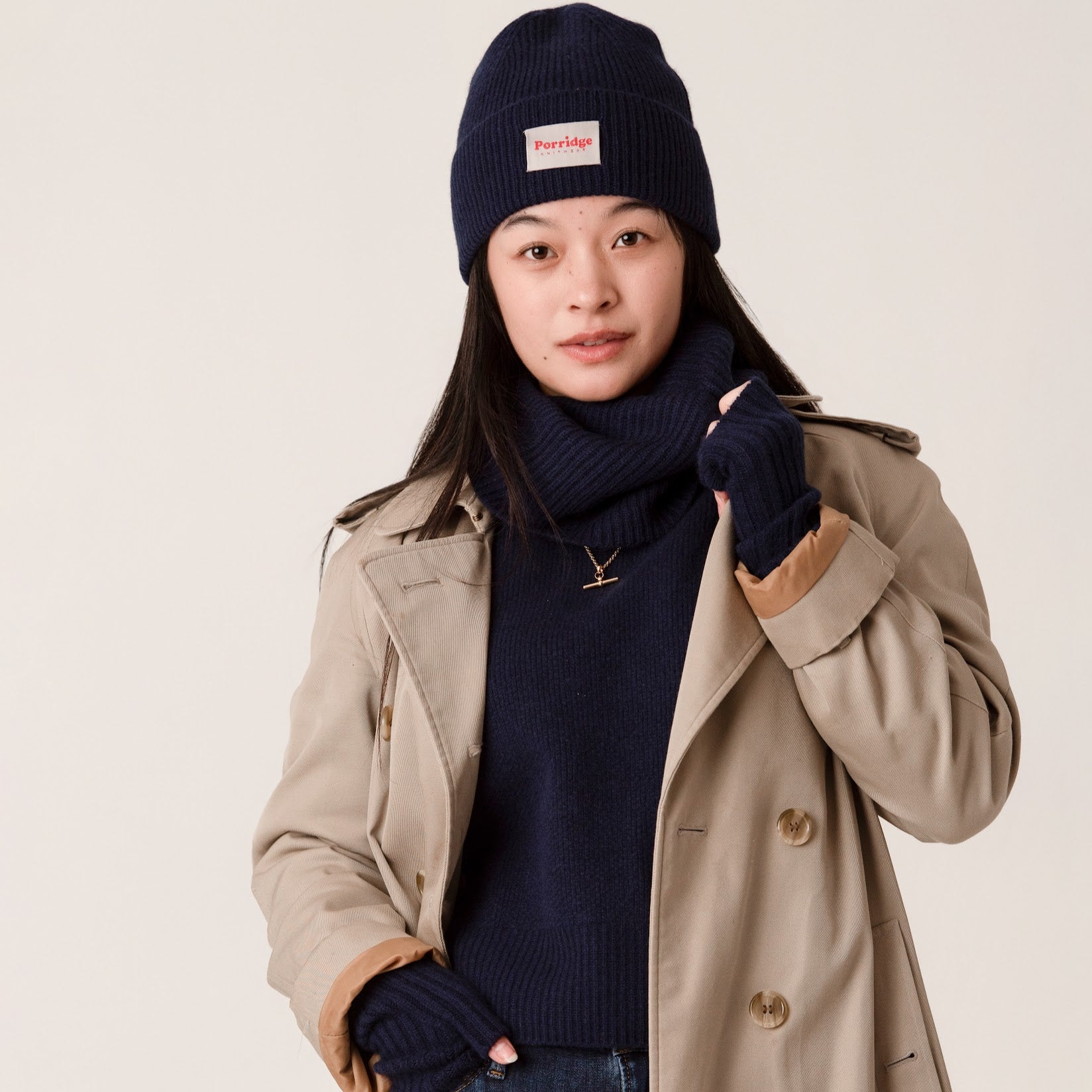 Navy cashmere jumper and accessories with a traditional Burberry trench coat