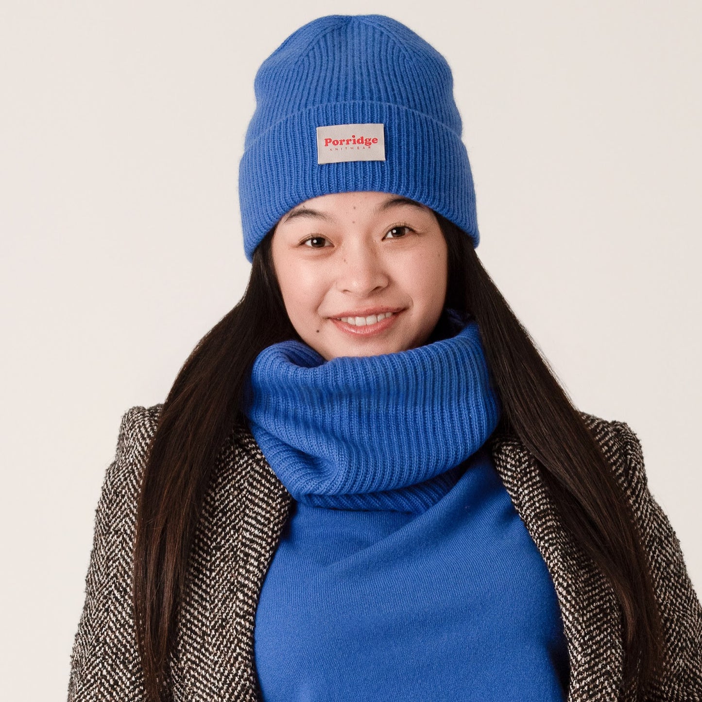 Blue cashmere accessories by Porridge knitwear with a grey tweed coat